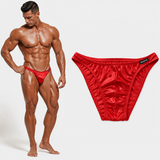 Thefreeway DN109 red competition bodybuilding posing trunks worn by a male bodybuilder in a relaxed pose with standalone product view