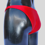 Costume bodybuilding da competizione rosso tinta unita Thefreeway Art. DN107 in Lycra, vista posteriore a tre quarti su manichino