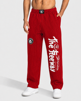Dettaglio di pantaloni bodybuilding unisex rossi a righe nere Thefreeway con logo bianco sulla gamba