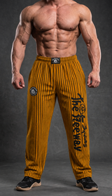 Bodybuilder con pantaloni unisex senape a righe nere Thefreeway con logo nero sulla gamba